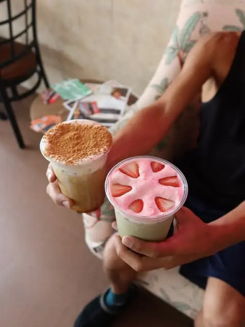 Two iced lattes with cold foam