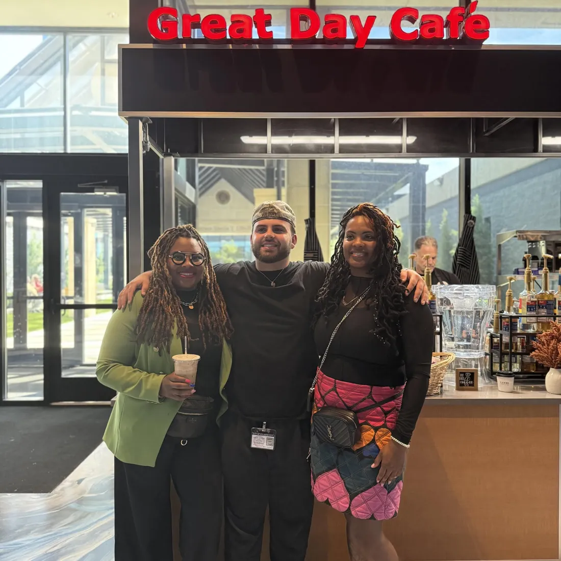 The owners of Beat the Daily Grind in front of the Great Day Café at City Hall
